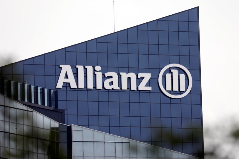 FILE PHOTO: The logo of insurer Allianz SE is seen on the company building in Puteaux, in the financial and business district of La Defense near Paris