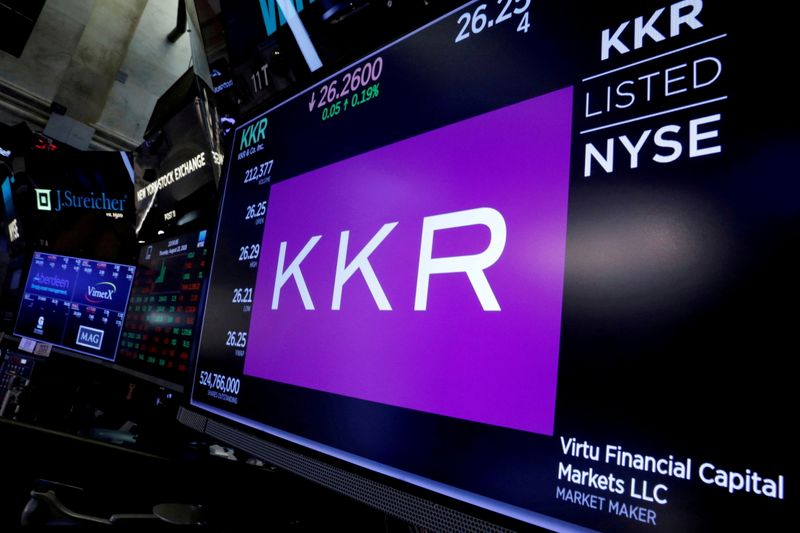 FILE PHOTO: Trading information for KKR & Co is displayed on a screen on the floor of the NYSE in New York