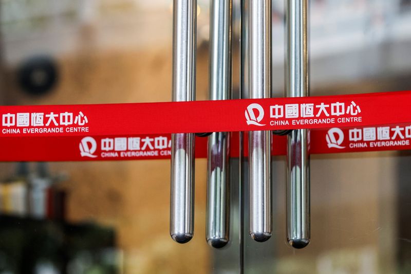 Logos of China Evergrande are seen on taps outside China Evergrande Centre building in Hong Kong