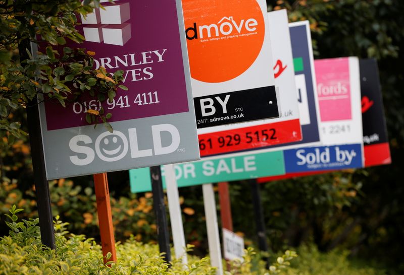 Estate Agent’s boards are lined up outside a housing development in Manchester