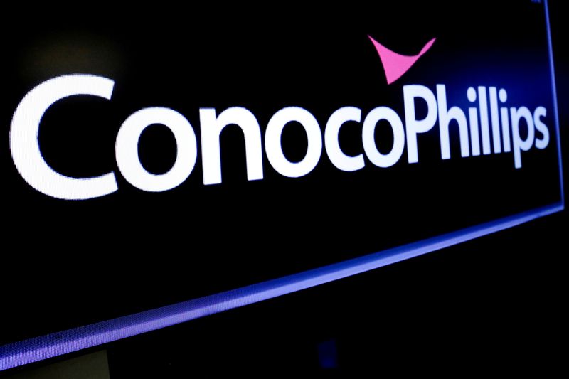 FILE PHOTO: The logo for ConocoPhillips is displayed on a screen on the floor at the NYSE in New York