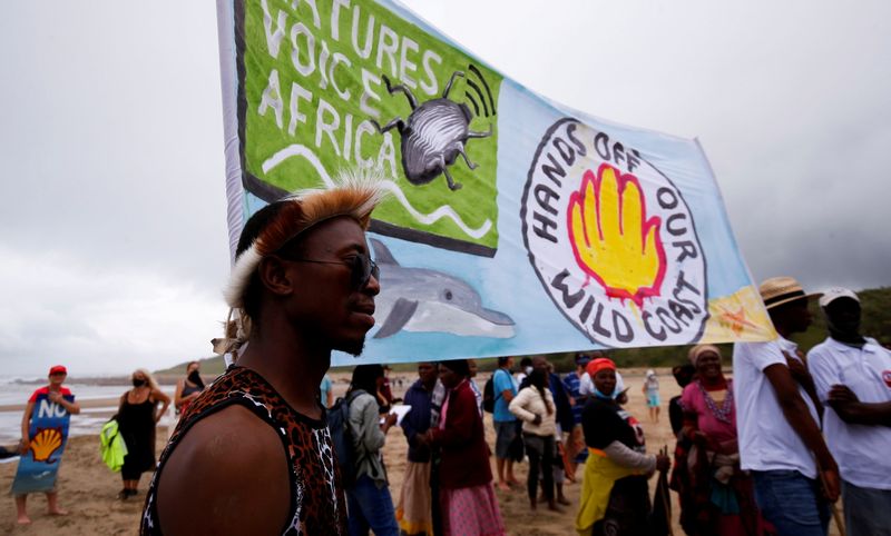 Reidents join a demonstration against Royal Dutch Shell's plans to start seismic surveys to explore for petroleum systems off the country's popular Wild Coast at Mzamba Beach, Sigidi