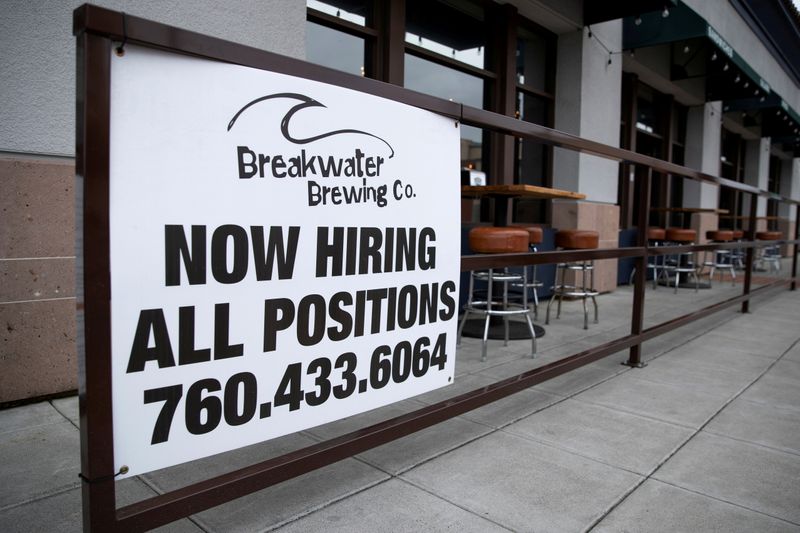 FILE PHOTO: A restaurant advertising jobs looks to attract workers in Oceanside, California