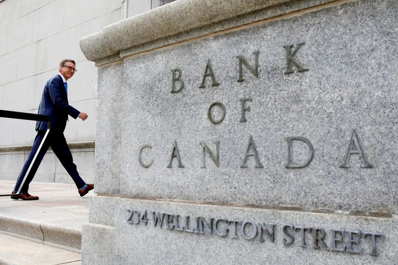 FILE PHOTO: Bank of Canada Governor Tiff Macklem walks outside the Bank of Canada building in Ottawa