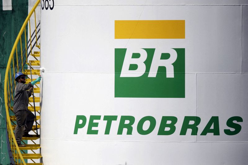 FILE PHOTO: A worker paints a tank of Brazil's state-run Petrobras oil company in Brasilia