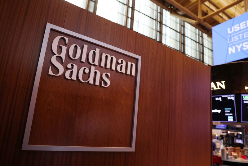 FILE PHOTO: The logo for Goldman Sachs is seen on the trading floor at the New York Stock Exchange (NYSE) in New York City