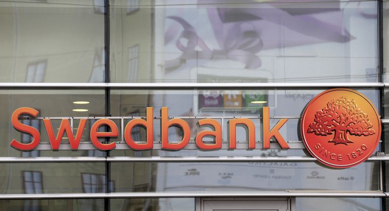 FILE PHOTO: Swedbank logo is pictured on its branch in Riga