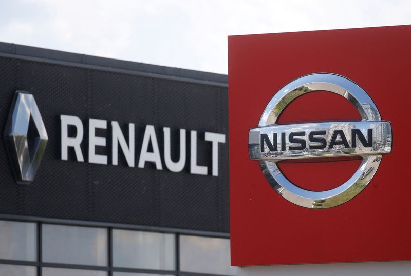 FILE PHOTO: The logos of car manufacturers Nissan and Renault are pictured at a dealership Kyiv