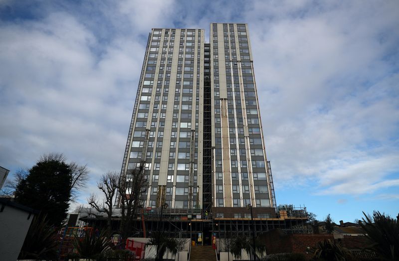 Cladding is removed from the outer walls of Dorney Tower residential block on the Chalcots estate in north London