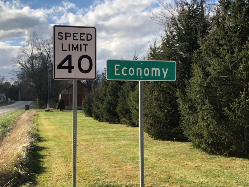 FILE PHOTO: A speed limit sign is seen beside a city sign for Economy, Indiana