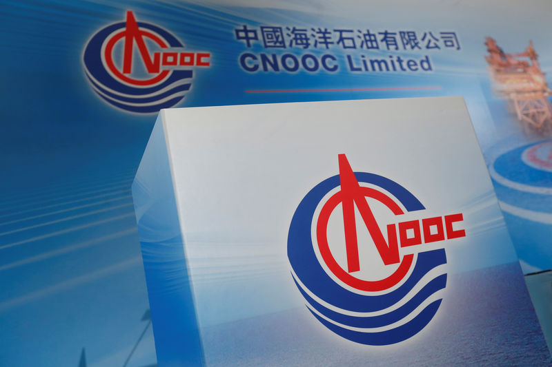 Logos of China National Offshore Oil Corporation (CNOOC) are displayed at a news conference in Hong Kong