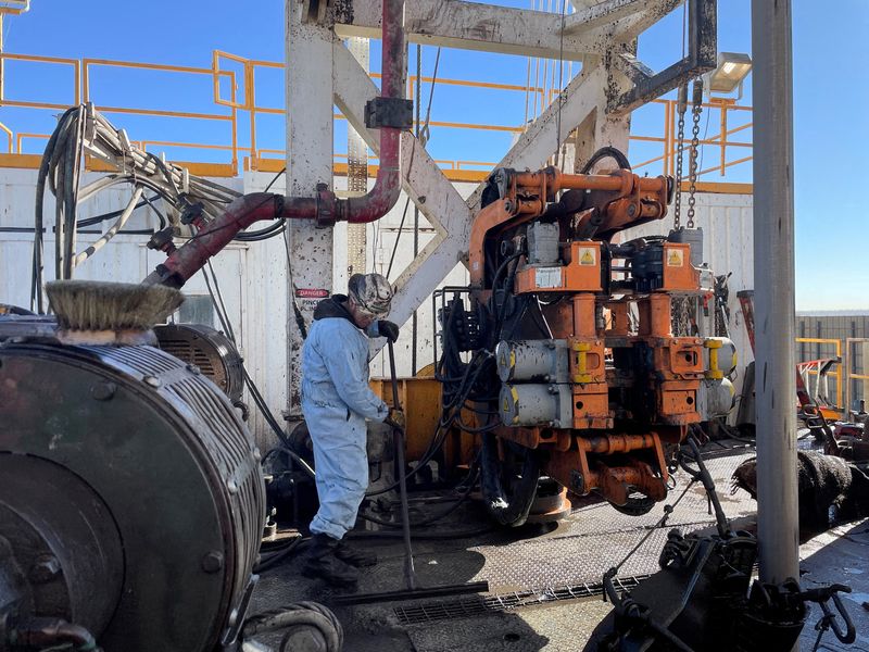 FILE PHOTO: A rig hand works on an electric drilling rig for oil producer Civitas Resources, at the Denver suburbs, in Broomfield