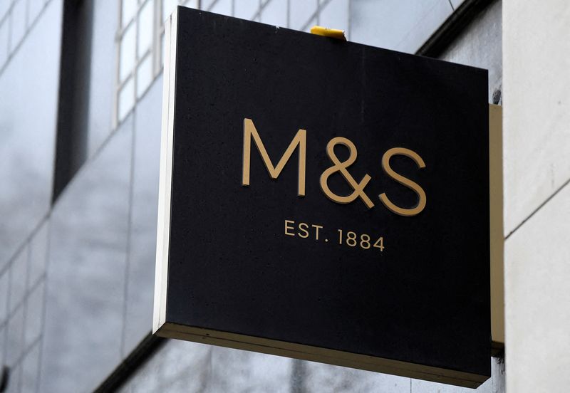 FILE PHOTO: A sign for Marks and Spencer (M&S) hangs outside one of their UK stores in London