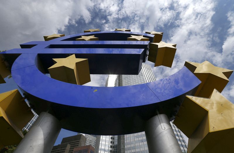 A huge euro logo is pictured past next to headquarters of ECB in Frankfurt