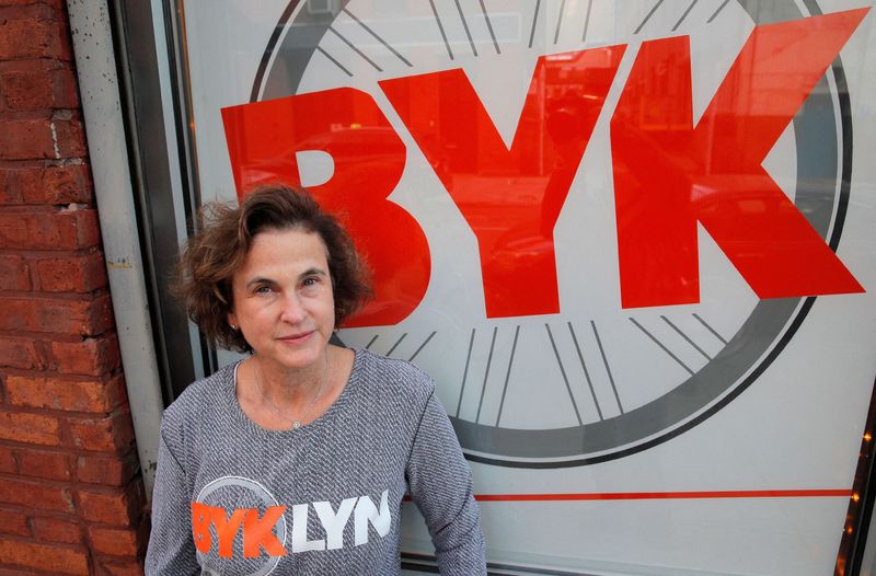 Amy Glosser poses outside her cycling studio, BYKlyn, in Brooklyn, New York