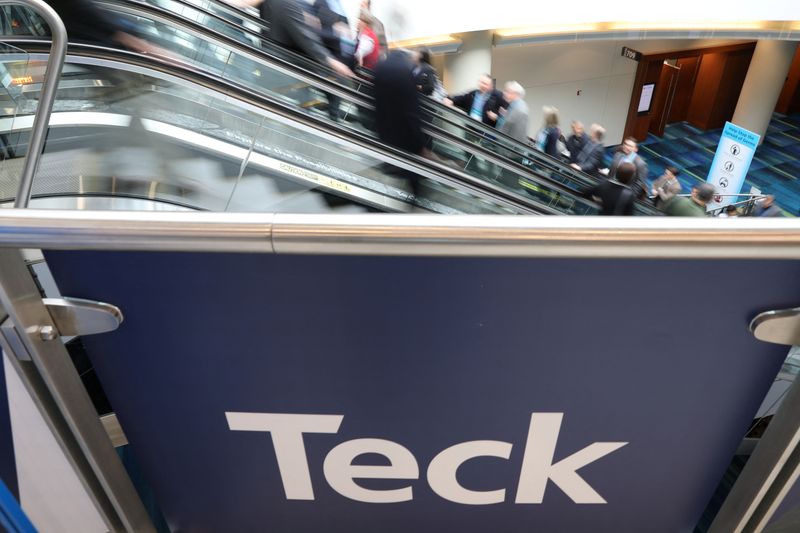 Visitors pass a sign of sponsor Teck Resources at the PDAC annual conference in Toronto