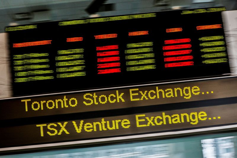 FILE PHOTO: A sign board displaying Toronto Stock Exchange stock information is seen in Toronto