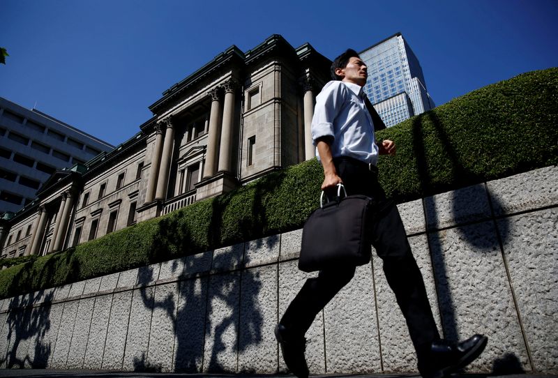 A man runs past the Bank of Japan (BOJ) building in Tokyo