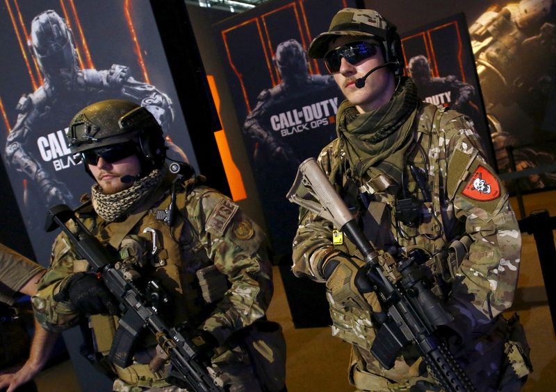 FILE PHOTO: FILE PHOTO: Men are dressed as soldiers to promote the video game 