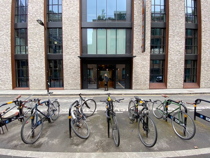 Bicycles are seen parked in front of an office building owned by Workspace in London