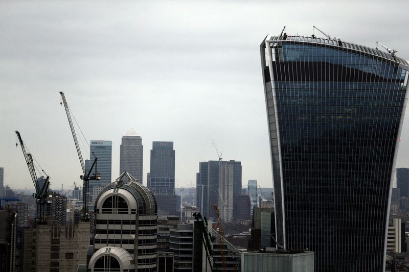 A view of the London skyline shows the Canary Wharf financial district of London and the Walkie Talkie building, in the City of London, seen from St Paul's Cathedral in London