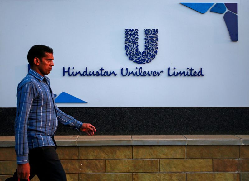 A pedestrian walks past the Hindustan Unilever Limited (HUL) headquarters in Mumbai