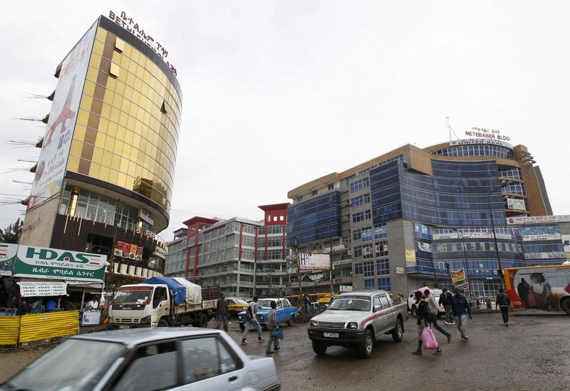 FILE PHOTO: People walk through the streets of a shopping area in Addis Ababa