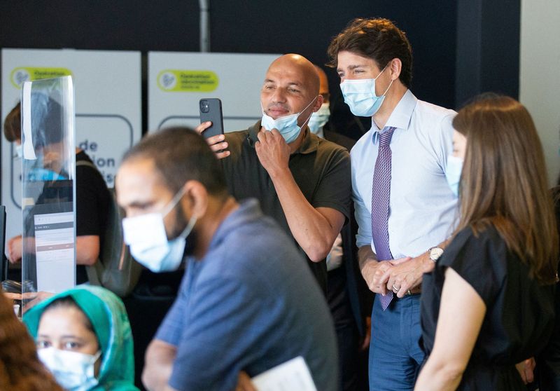 FILE PHOTO: Canada's Prime Minister Trudeau visits a vaccination site in Montreal