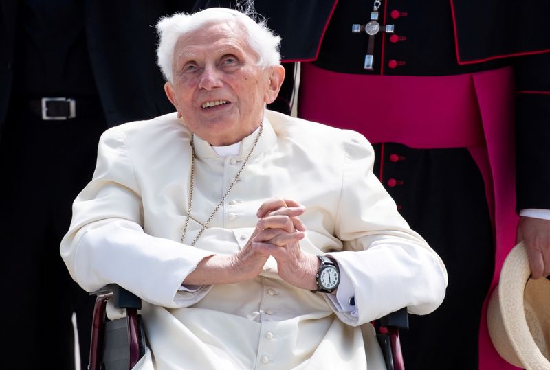 FILE PHOTO: Pope Emeritus Benedict XVI gestures at the Munich Airport before his departure to Rome
