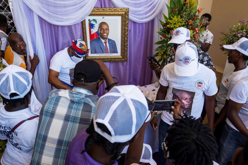 People attend a memorial for slain Haitian President Jovenel Moise at the city hall in Cap-Haitien