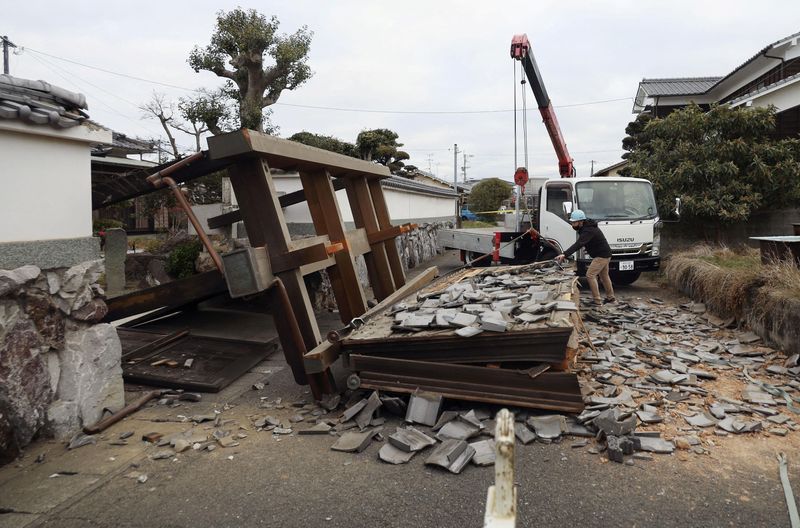 A collapsed gate to the residential house caused by an earthquake is seen in Oita, southern Japan
