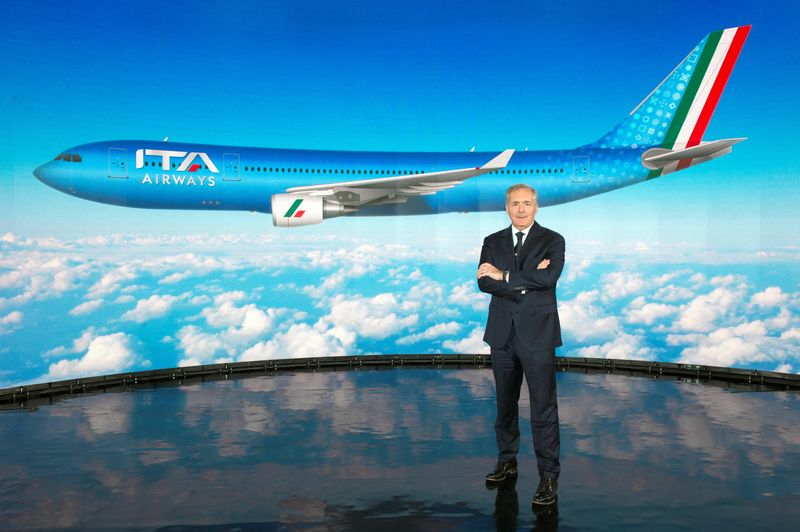 FILE PHOTO: ITA Airways Chairman Alfredo Altavilla poses with the image of the new livery for the carrier's jets