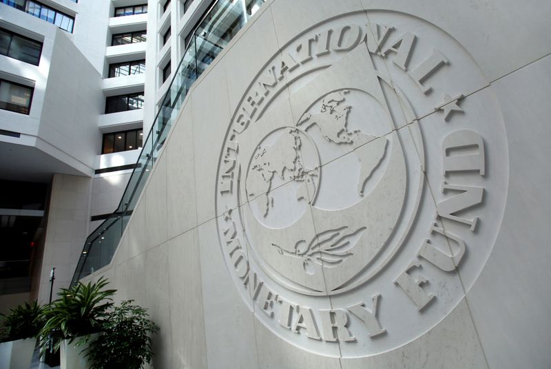 FILE PHOTO: The International Monetary Fund logo is seen inside its headquarters at the end of the IMF/World Bank annual meetings in Washington