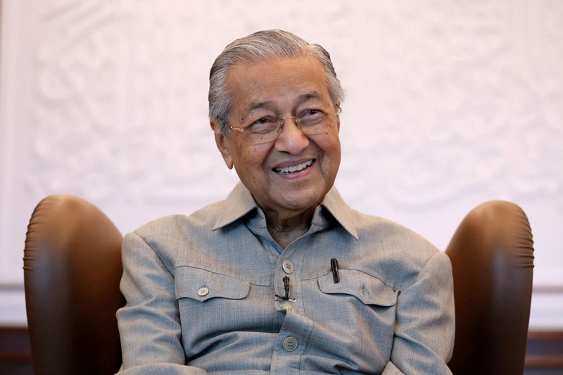 FILE PHOTO: Malaysia's former PM Mahathir reacts during an interview in Kuala Lumpur