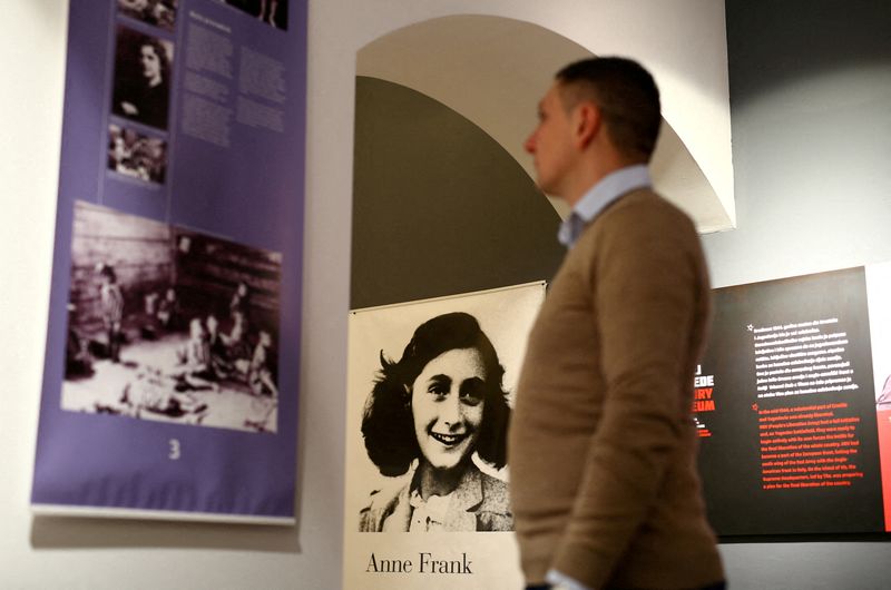 FILE PHOTO: A man looks at an exhibition about Anne Frank at the Victory museum in Sibenik, Croatia