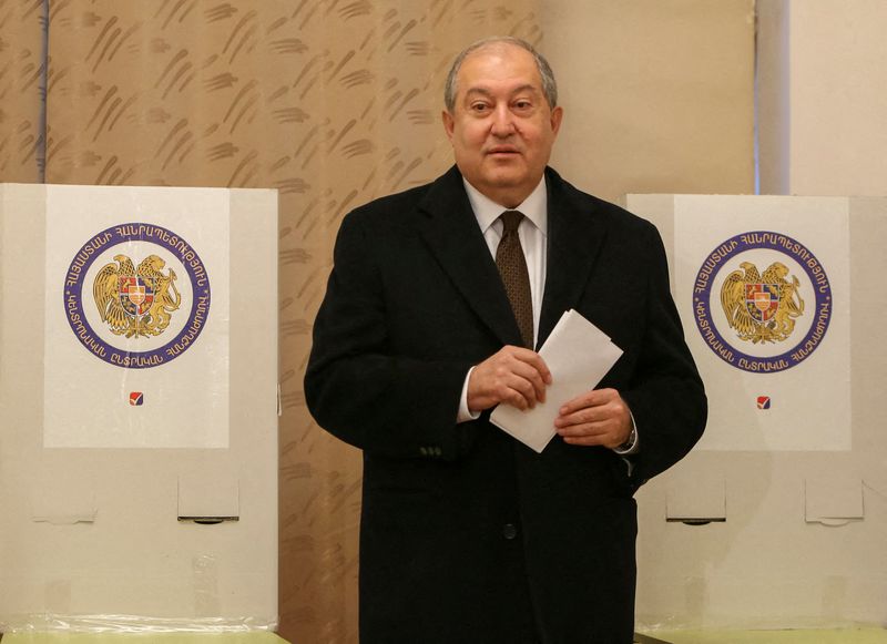 FILE PHOTO: Armenian President Armen Sarkissian votes during an early parliamentary election in Yerevan, Armenia