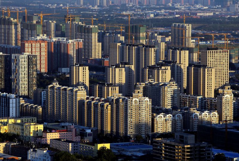 FILE PHOTO: Buildings are seen at sunset in Beijing