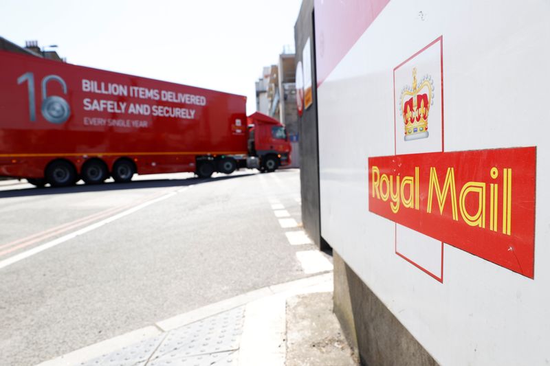 FILE PHOTO: The logo of Royal Mail is seen outside the Mount Pleasant Sorting Office as a delivery vehicle arrives, in London