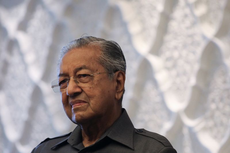 Malaysia's former Prime Minister Mahathir Mohamad reacts during an interview with Reuters in Kuala Lumpur