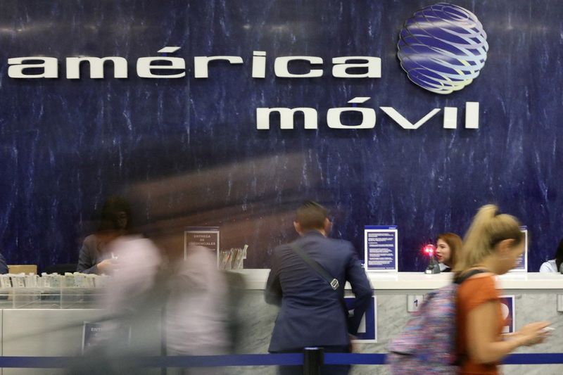 FILE PHOTO: The logo of America Movil is pictured on the wall of a reception area in the company's corporate offices in Mexico City