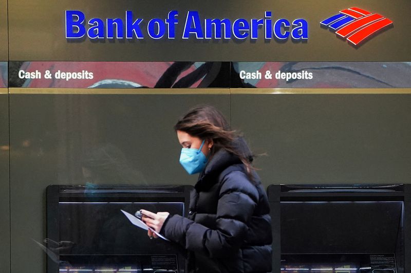 FILE PHOTO: Person walks past a Bank of America sign in New York City