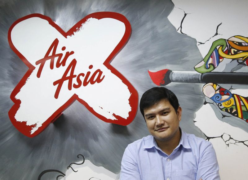 Acting AirAsia X CEO Benyamin Ismail poses for photographs at his office in Sepang, outside Kuala Lumpur