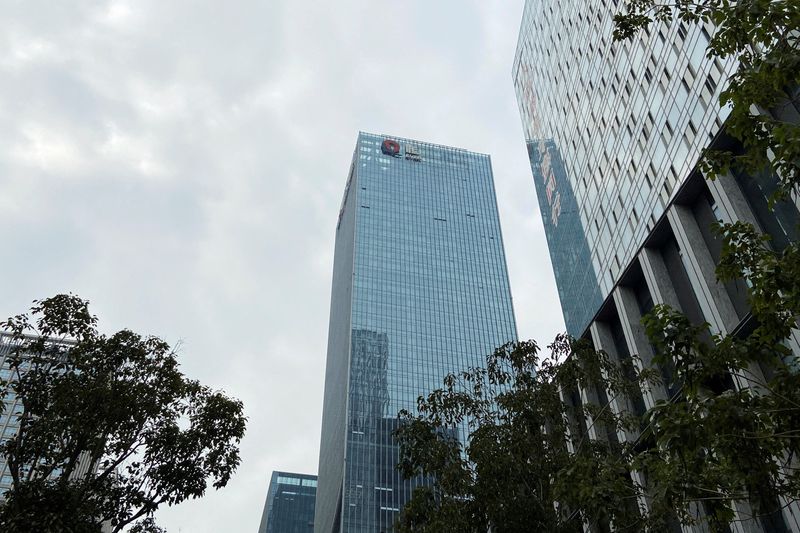 FILE PHOTO: Partially removed company logo of China Evergrande Group in Shenzhen, China