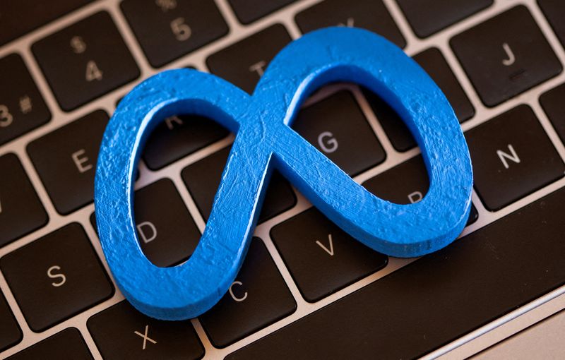 FILE PHOTO: A 3D printed Facebook's new rebrand logo Meta is placed on laptop keyboard in this illustration