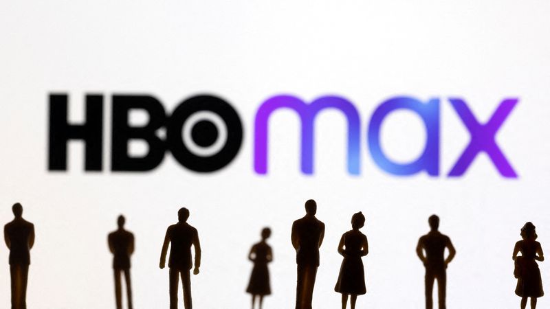 FILE PHOTO - Toy figures of people are seen in front of the displayed HBO Max logo, in this illustration