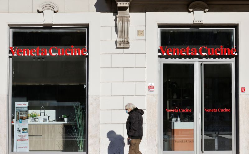 A man walks past Veneta Cucine store amid the COVID-19 pandemic in Rome