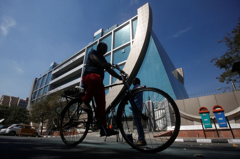 A man rides his bicycle past India's Central Bureau of Investigation (CBI) headquarters building in New Delhi