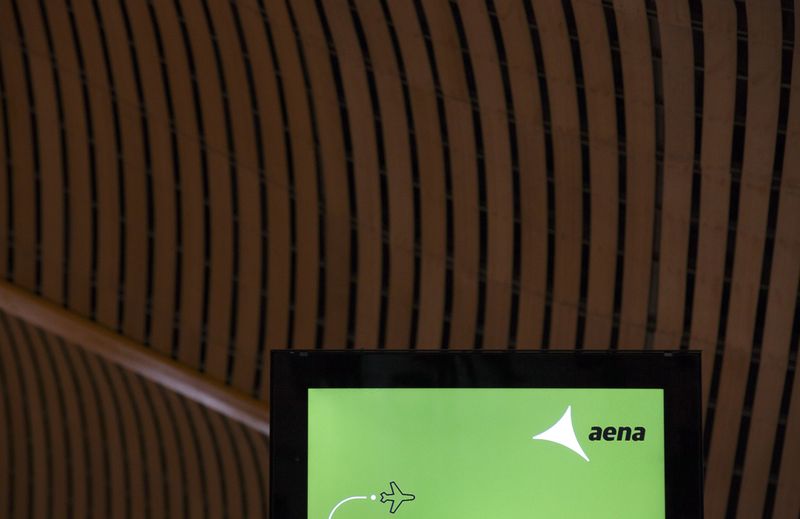 The logo of Spanish airport operator AENA is displayed on a screen at Terminal 4 of Madrid's Adolfo Suarez Barajas airport