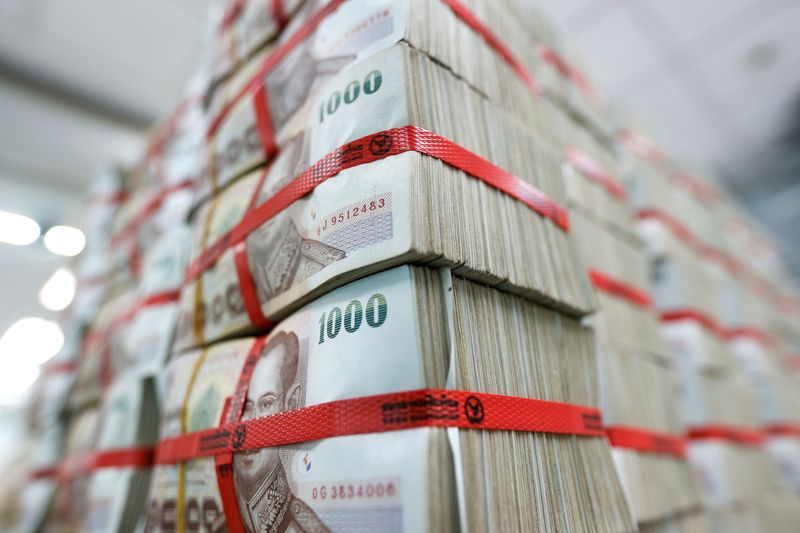 FILE PHOTO: Thai baht notes are seen at a Kasikornbank in Bangkok