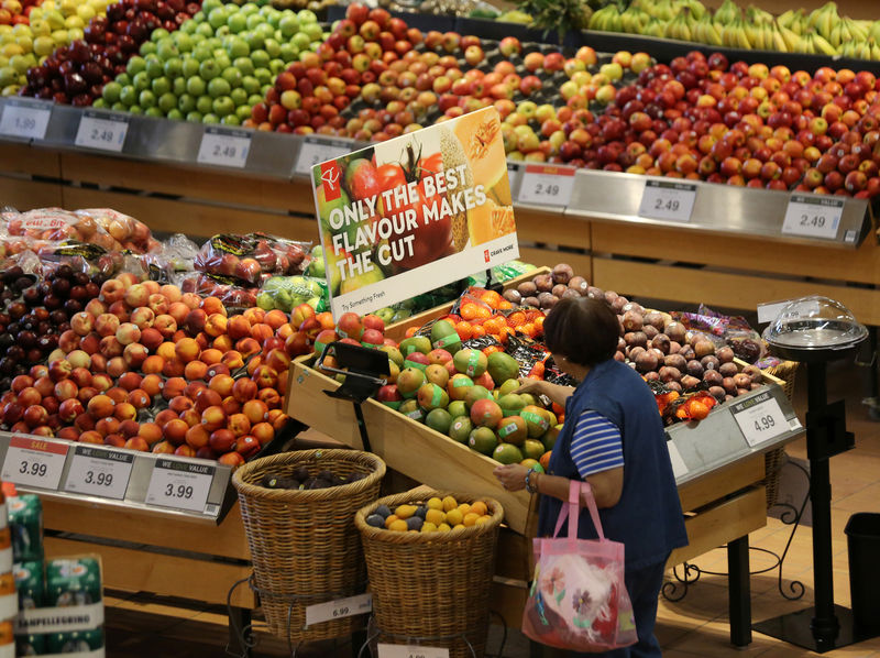 A woman browses in the fruit section of a Loblaw supermarket in Collingwood